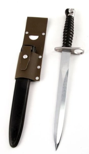 SWISS SIG57 BAYONET WITH SCABBARD AND FROG: A 1957 model bayonet with black plastic grip, black scabbard, and green vinyl frog. In very good condition with minor wear to the scabbard.