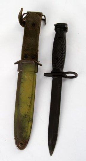 USA M4 BAYONET WITH SCABBARD AND FROG FOR M1: M4 bayonet with M8A1 scabbard. Fits M1 Carbine. Blade has signs of wear and small amounts of surface rust. Diamond fine grip. Locking mechanism functional. Scabbard has signs of wear and a few small d