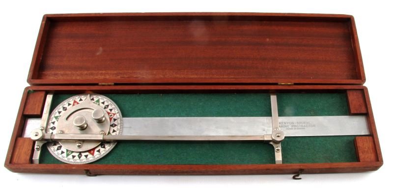 KENYON & BRUEL MARINE PROTRACTOR IN WOODEN CASE: A marine protractor made by Kenyon & Bruel. Case measures 22.75 by 6 inches. In very good condition.