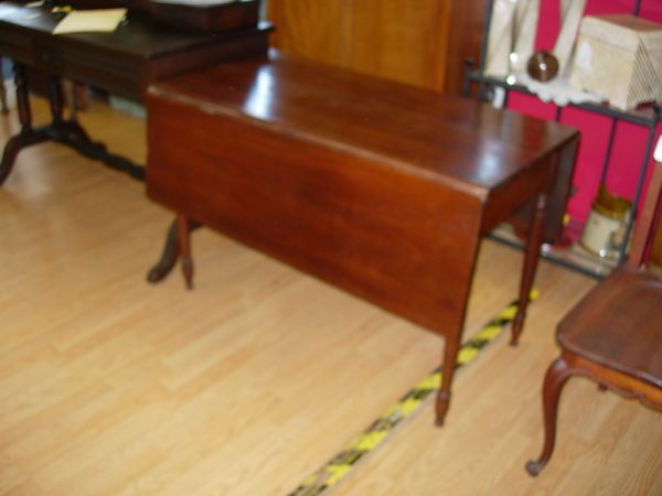 ANTIQUE SHERATON DROP LEAF TABLE WALNUT SHERATON: ANTIQUE SHERIDAN DROP LEAF TABLE WALNUT SHERIDAN DROP LEAF TABLE W TURNED SPINDLE LEGS CRACK ON TOP OTHERWISE NICE OLD PIECE 27"H 42"W 20" D W 13"D LEAVES