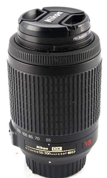 NIKON DX NIKKOR 55-200MM AF-S VR 1:4-5.6 G ED: Nikon mount lens with 55-200 zoom capability and F/4-5.6 maximum aperture. Tested and working well. In very good used condition. Optics are clean and free of damage. Includes both endcaps and a UV fil