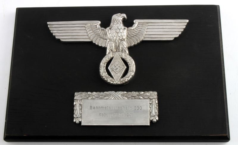 WWII THIRD REICH GERMAN HITLER YOUTH WALL PLAQUE: Features a hitler youth eagle superimposed over a plaque that reads " Bannmeisterschatf 330 / Koburg 7. 9. 1941". In very good condition. Unauthenticated, sold as-is. Measures 12 by 8 inches. This lot