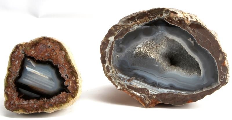 BLUE GREY AGATE GEODE DRUZY POLISHED CRYSTALS 2PC: Two blue grey agate geodes. Large measures 6 by 3 inches and weighs 4.2 pounds. Small one measures 4 by 2 inches and weighs 1.2 pounds. The larger has druzy crystals to center, both polished, fine con