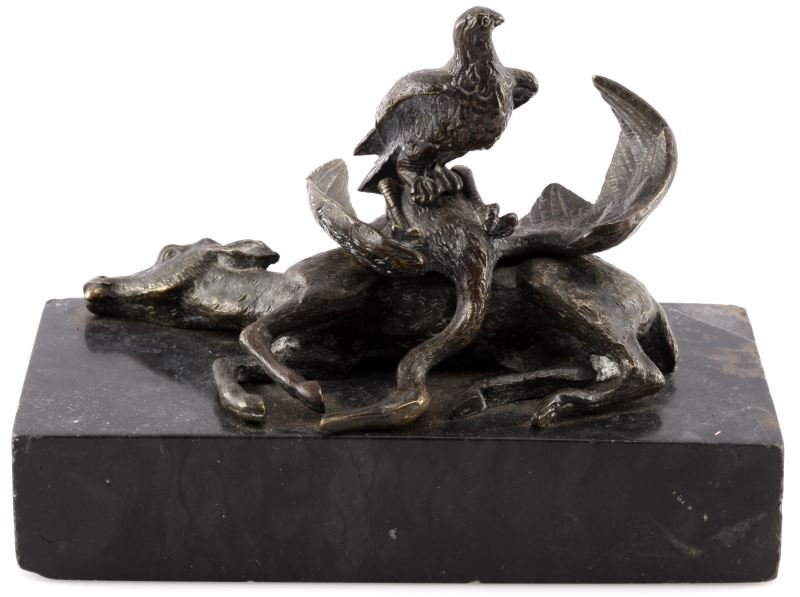EAGLE WITH PREY BRONZE SCULPTURE ON MARBLE BASE: Small bronze sculpture on black marble base. The work does not appear to be signed. The sculpture depicts a triumphant eagle resting upon the carcass of a swan and fawn. The fur and feathers all caref