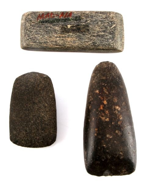 LOT OF 3 NATIVE AMERICAN STONE CELTS CREEK INDIANS: Lot of 3 Native American stone celts. One is made from dark speckled stone with smooth patina and sticker to one side (Wilkinson Co., GA, Creek Indians) 5 inches long. One is rectangular with charcoal