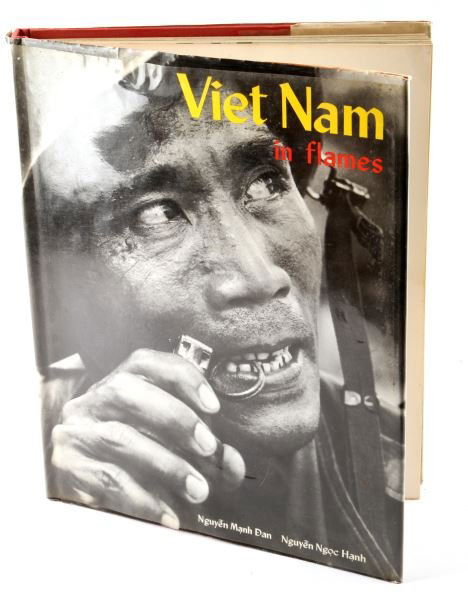 VIET NAM IN FLAMES BY NGUYEN DAN RARE HARDCOVER: Viet Nam in Flames by Nguyen Manh Dan and Nguyen Ngoc Hanh book of photographs taken by various native photographers that received international and domestic recognition after the war. This is a highl