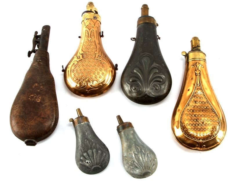 ANTIQUE POWDER FLASK MEASURE LOT OF 6 WITH 1 DIXON: Leather flask with shot, Dixon polished brass, two other larger one and two smaller ones, all very good and serviceable.