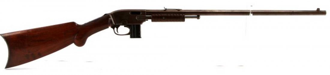 SAVAGE MODEL 1903 PUMP ACTION .22 CALIBER RIFLE: Savage Arms Model 1903 pump action .22 caliber rifle with one clip. Pre-patent date, as indicated on barrel. Fixed front sight, adjustable rear sight. Wooden stock with a few scratches. Bore in good c