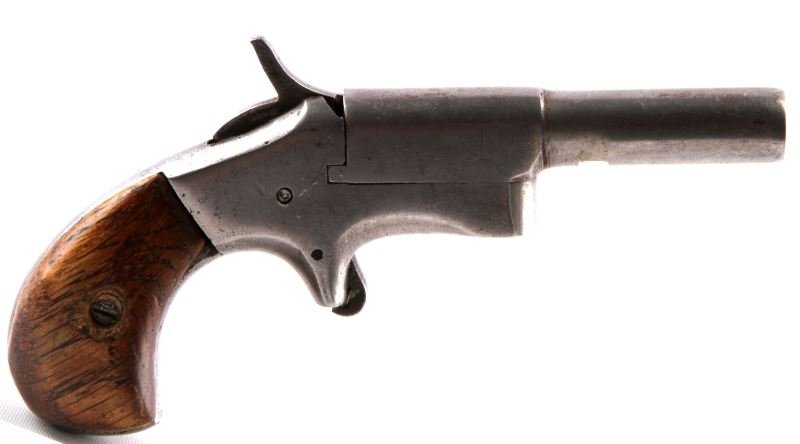 ANTIQUE HOPKINS & ALLEN .32 RIMFIRE DERRINGER: Antique Hopkins & Allen side swing .32 Rimfire Derringer. Wood grips, spotted grey patina, barrel measures just under 3 inches. Bore is good for age. Comes with shearling lined soft case.
