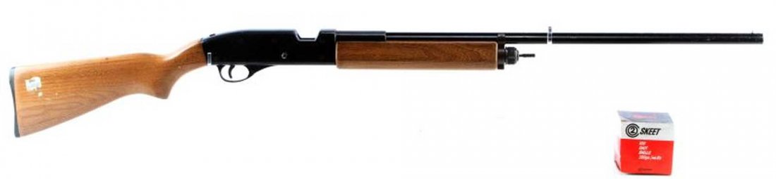CROSMAN TRAP MASTER 1100 CO2 POWERED SHOTGUN: Crosman Trap Master 1100 C02 powered shotgun. Front bead sight. Wooden stock and forearm. Comes with a box of .380 gauge skeet rounds. Some dings and scratches on stock. Overall very good condition.
