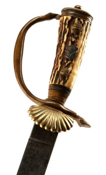 WWII THIRD REICH DEUTSCHE JAGERSCHAFT CUTLASS: A hunting cutlass with stag horn handle with Reichsbund Deutsche Jagerschaft insignia. The steel blade is marked with a pair of back to back squirrels signifying the firm of Carl Eickhorn Solingen. Me