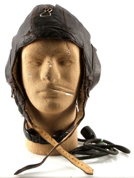 WWII GERMAN LUFTWAFFE FLYING HELMET & THROAT MIKE: LKpW101 Leather helmet with throat microphone and plug, very good condition.