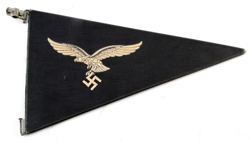 WWII THIRD REICH GERMAN LUFTWAFFE CAR PENNANT: WWII Luftwaffe staff car pennant. Finely stitched eagle on grey-blue background. Steel hardware. Measures 14 inches long. Two moth holes, otherwise good.