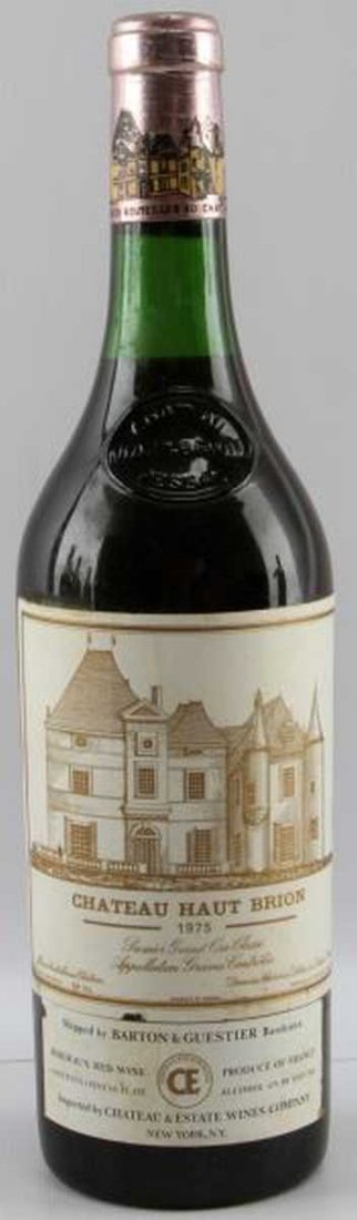 1975 CHATEAU HAUT BRION VINTAGE BORDEAUX RED WINE: Vintage 1975 Chateau Haut Brion Bordeaux red wine with neck ullage. Deep cherry color. Tight sealed cork. Label clear and legible. Red still wine.