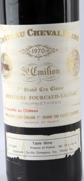 1970 CHATEAU CHEVAL BLANC ST EMILION TOP ULLAGE: Vintage 1970 Chateau Cheval Blanc St. Emilion Bordeaux red wine with top shoulder ullage. Deep cherry color. Tight sealed cork. Label complete and clear. Red table wine.