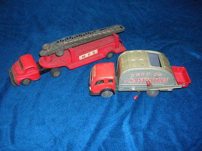 ANTIQUE TOY FIRE TRUCK JAPAN W SANITATION TRUCK: ANTIQUE TOY FIRE TRUCK JAPAN W SANITATION TRUCK FROM AN ESTATE TO BE AUCTIONED 12/3 MFD JAPAN FIRE TRUCK LADDER STILL WORKS REAR WHEEL AXLE LOOSE AND SOME PAINT LOSS GOOD CONDITION OTHERWISE 12" L
