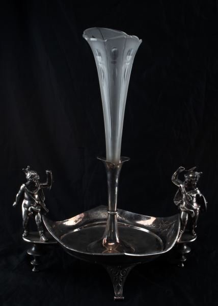 VINTAGE SILVER PLATED AND FROSTED GLASS EPERGNE: Vintage silver plated and frosted glass epergne. Strong soldered silver with one stem to center and a small gladiator figure to each side. Measures 19.5 inches tall. Flea-bite edge loss. One inch open