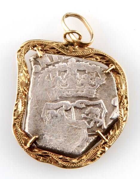 TREASURE COIN SILVER SPANISH COB IN 14K MOUNTING: Without COA, mounting is stamped Bahama 14K, tota weight with mounting is 15.6 grams and measures 32MM at its widest point.