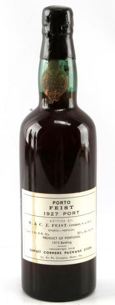 VINTAGE 1927 PORTO FEIST RED PORT WINE NECK ULLAGE: Vintage 1927 Porto Feist bottled in 1973. Label and seal still present. Neck ullage. Bright red color. The label is stained but complete. Tight wax sealed cork.1 pt 9 fl oz.