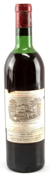 1970 CHATEAU LAFITE-ROTHSCHILD RED BORDEAUX: Vintage 1970 Chateau Lafite-Rothschild red Bordeaux blend. Label and seal still present. Top shoulder ullage. Cherry red color. The label has some foxing and tears, but overall good condition. Tight w