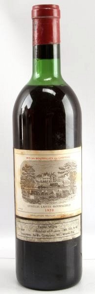1970 VINTAGE LAFITE-ROTHSCHILD RED BORDEAUX WINE: Vintage 1970 Chateau Lafite-Rothschild red Bordeaux blend. Label and seal still present. Top shoulder ullage. Cherry red color. The label has some stains, but overall good condition. Tight sealed cork