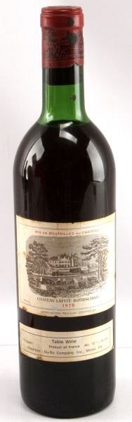 1970 CHATEAU LAFITE-ROTHSCHILD RED BORDEAUX: Vintage 1970 Chateau Lafite-Rothschild red Bordeaux blend. Label and seal still present. Top shoulder ullage. Cherry red color. The label is discolored, but overall good condition. Tight wax sealed co
