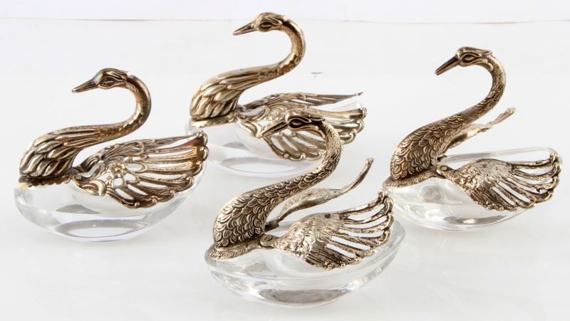 4 .800 SILVER SWAN OPENING WINGS TABLE SALT CELLAR: Two different pairs each marked .800, crystal salt cellar and silver swans with wings spreading to access the cellars.