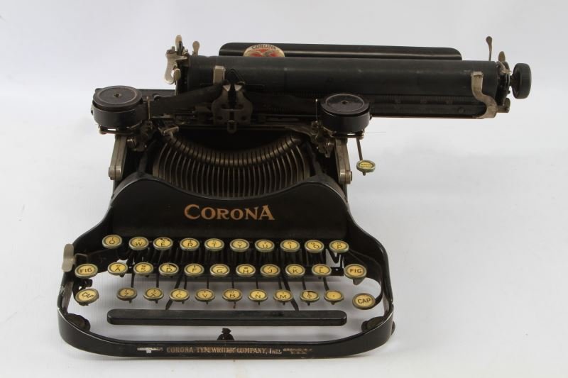 VINTAGE WORKING CORONA FOLDING TYPEWRITER: In working condition (needs new ribbon), vintage Corona portable typewriter, folding top, all keys working, a few just a little stiff. Very good condition for age.