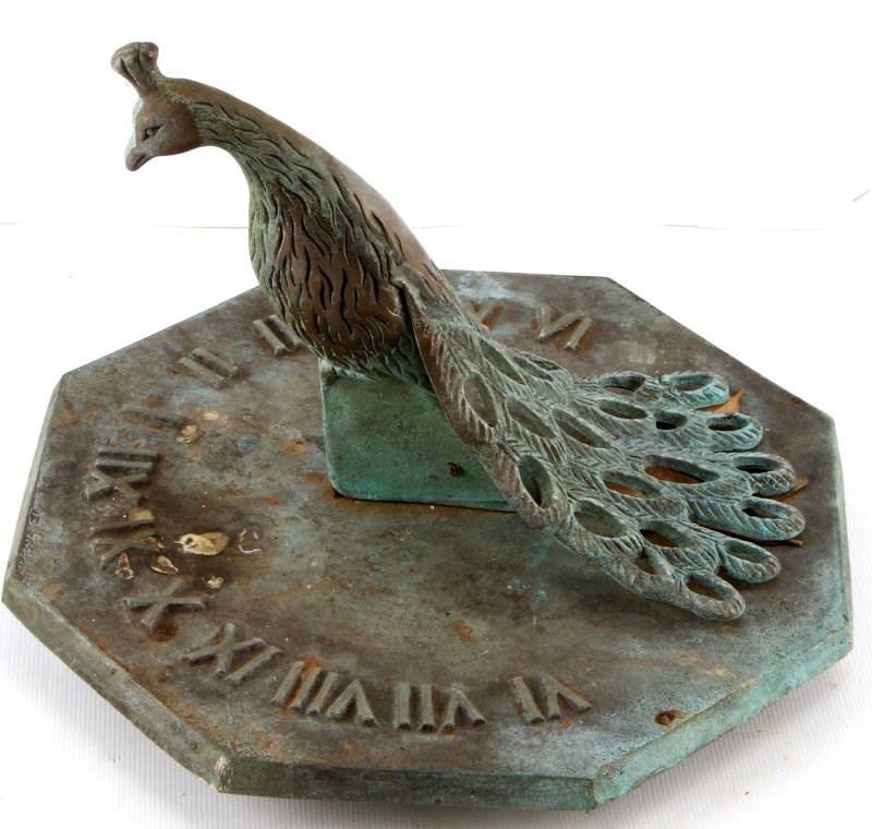PEACOCK SUNDIAL AGED 7 INCHES TALL BY 8.5" WIDE: Unmarked peacock sundial with verdigris throughout. Measures 7 inches tall by 8.5 inches. Overall very good condition despite aged patina.