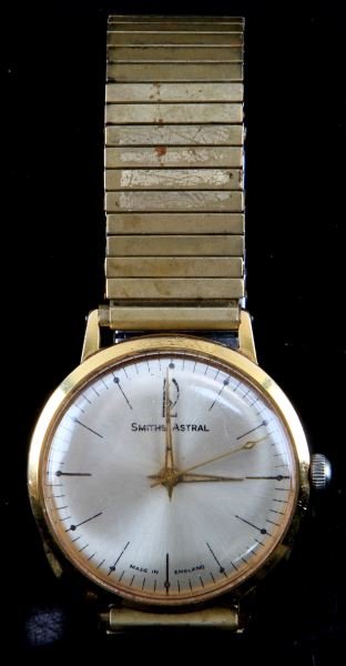 VINTAGE SMITHS ASTRAL JEWELED MOVEMENT WATCH: Vintage jeweled stem wind and set movement, gold plate over base metal case, made in England by Smiths. Astral model in running condition (no imp[lied warranty). Expandable bracelet. White dial in goo