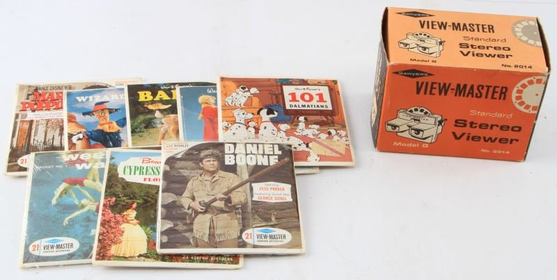 VINTAGE MODEL G VIEWMASTER VIEWER W/7 REEL PACKETS: From 1960's, G model number 2014 View-master stereo viewer, with seven different reel subjects, including "Daniel Boone", "Mary Poppins", "Wizard of Oz", "Bambi", "Sword In The Stone", "101 Dalmatians