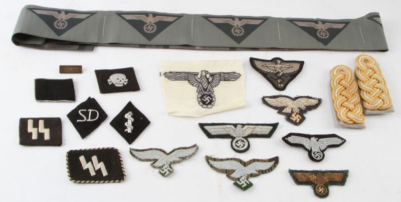 WWII THIRD REICH GERMAN PATCHES ARM BAND MORE LOT: WWII Nazi Germany mixed patch lot. Includes: Luftwaffe eagle patches, few with bullion, SS Panzer collar patches, strand of uncut grey green arm bands, Officer's shoulder boards. Good to very good con