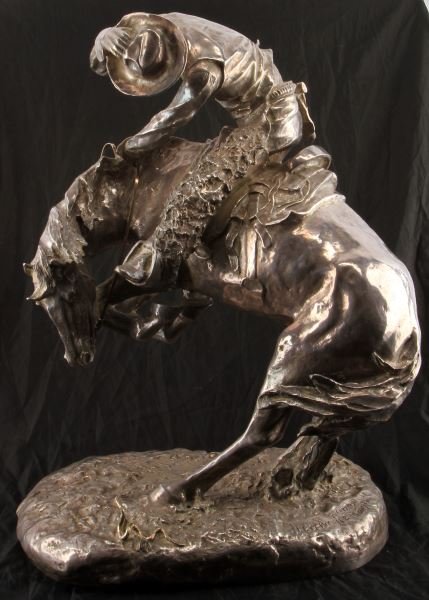 REMINGTON "THE RATTLESNAKE" .999 SILVER 1000+ OZT: A 1000+ Troy ounce .999 fine silver sculpture after Frederic Remington's "The Rattlesnake", number 6 of a series of 100. This piece was cast from one of Remington's original masterpieces in 1989, and 
