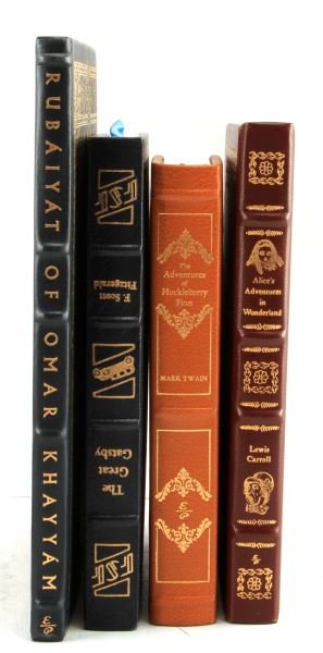 4 EASTON PRESS LEATHER BOUND LIMITED EDITION BOOKS: Four leather bound volumes each from 1976 and in pristine condition, titles in this lot include. The Great Gatsby, Adventures of Huckleberry Finn, Rubaiyat of Omar Khayyam, and Alice in Wonderland.