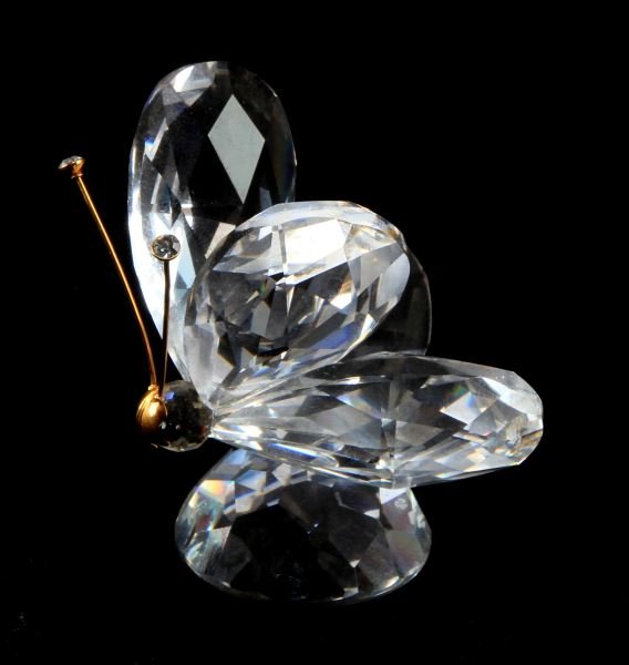 SWAROVSKI CRYSTAL BUTTERFLY VARIATION TWO 2" TALL: Retired Swarovski crystal butterfly figurine from the "In a Summer Meadow" collection. The figurine has golden antenna and a golden nose. Very good condition; no chips or cracks. Measures 2 inches tal