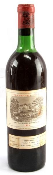 BORDEAUX 1970 VINTAGE LAFITE ROTHSCHILD RED WINE: Vintage 1970 Chateau Lafite-Rothschild red Bordeaux blend. Label and seal still present. Top shoulder ullage. Cherry red color. The label is in very good condition. Tight sealed cork. 3/4 quart.