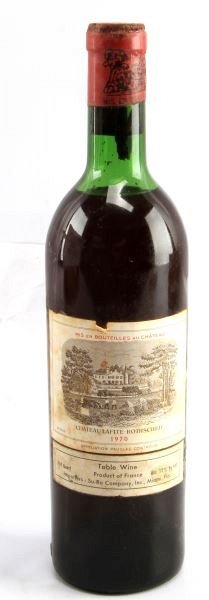 1970 CHATEAU LAFITE ROTHSCHILD BORDEAUX BLEND VTG: Vintage 1970 Chateau Lafite-Rothschild red Bordeaux blend. Label and seal still present. Top shoulder ullage. Cherry red color. The label has some foxing and tears, but overall good condition. Tight w