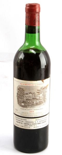 VINTAGE BORDEAUX CHATEAU LAFITE ROTHSCHILD 1975: Vintage 1975 Chateau Lafite-Rothschild red Bordeaux blend. Label and seal still present. Top shoulder ullage. Cherry red color. The label has a stain and discoloration, but overall very good condition