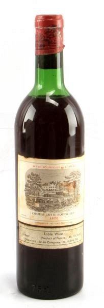 VINTAGE CHATEAU LAFITE ROTHSCHILD 1970 BORDEAUX: Vintage 1970 Chateau Lafite-Rothschild red Bordeaux blend. Label and seal still present. Top shoulder ullage. Cherry red color. The label has some foxing and tears, but overall good condition. Tight w