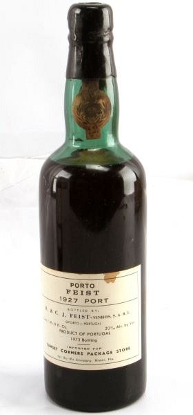 VTG 1927 PORTO FEIST PORT RED WINE 1973 BOTTLING: Vintage 1927 Porto Feist, bottled in 1973. Label and seal still present. Low shoulder ullage. Cherry red color. The label is in overall good condition. Sealed cork. 1 pint 9 fluid ounces.