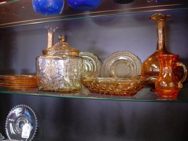 AMBER GLASS LOT OF 12 CRACKLED GLASS DECANTER 9 IN: AMBER GLASS LOT OF 12 CRACKLED GLASS DECANTER 9 INC HANDLED CREAMER 4", 2 AMBER DISHES 6", 7 SAUCERS 6" , GOLD OVERLAY BUD VASE 9 1/2", CANDY DISH 10"L, LIDDED JAR 7 1/2", CANDY DISH 6 1/2" NICE LOT