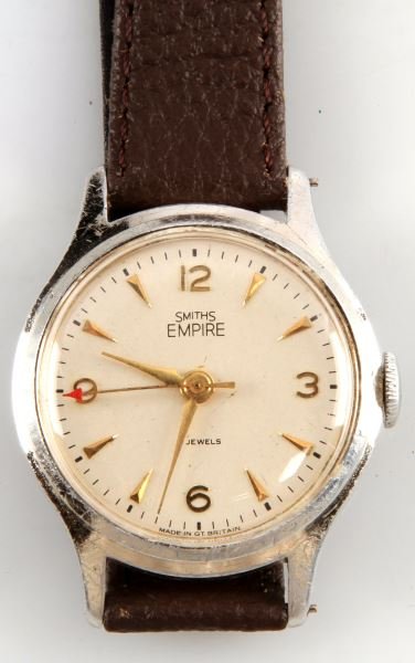 MENS VINTAGE SMITHS EMPIRE JEWELED MVMNT WATCH: By Smiths of Great Britain, Empire series, 33mm nickel plated case, white dial in good condition with "Red Arrow" second hand, watch working, brown leather strap. In good condition.