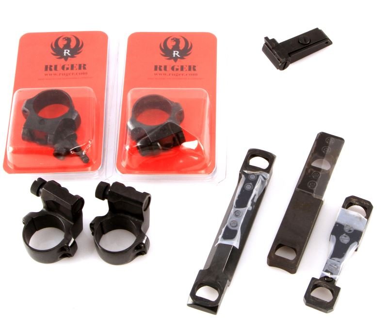 MIXED LOT RUGER SCOPE RINGS & 3 BASES LEUPOLD TC: Mixed lot of scope rings and bases, 8 pieces total. Includes: 2 Ruger Offset 1 inch medium height scope rings, 2 4B scope ring assemblies (.937), 2 Thompson Center scope bases, one Leupold base, and r