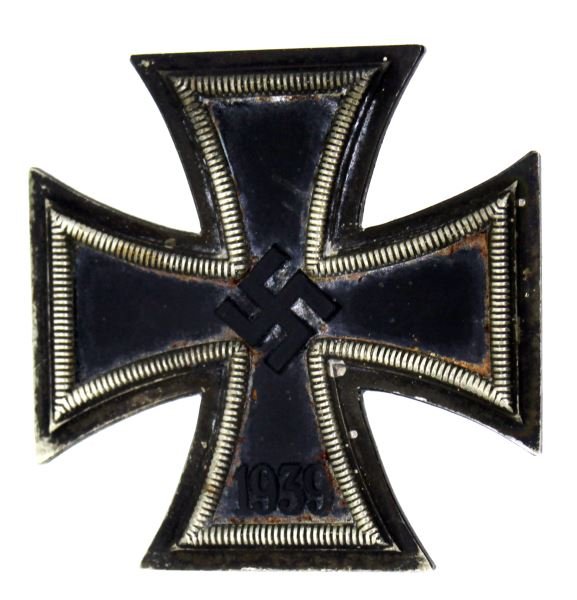 WWII THIRD REICH GERMAN IRON CROSS 1ST CLASS: A first class Iron Cross with rear broad tapered pin with 90 degree pin lie, barrel hinge and "C" catch. In good condition with some patina an oxidation. Three piece construction with ferrous center p