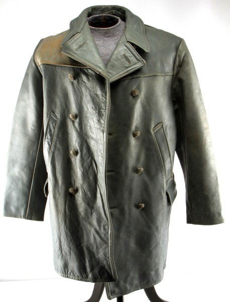 WWII GERMAN KRIEGSMARINE LEATHER U-BOAT COAT: Grey leather, 8 button double breasted with correct Kriegsmarine buttons, Kriegsmarine Eagle embossed at right flap, tag dated 1942 Euro size 56, firm Hilbert Chemnitz, very good wearable condition.