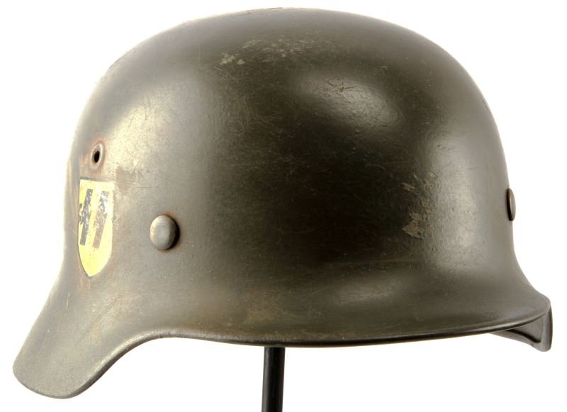 GERMAN WWII WAFFEN SS SINGLE DECAL M40 COMBAT HELM: German WWII Waffen SS Single Decal M40 combat helmet. Includes brown leather liner with steel band. Minor scuffs, overall very good. RARE.