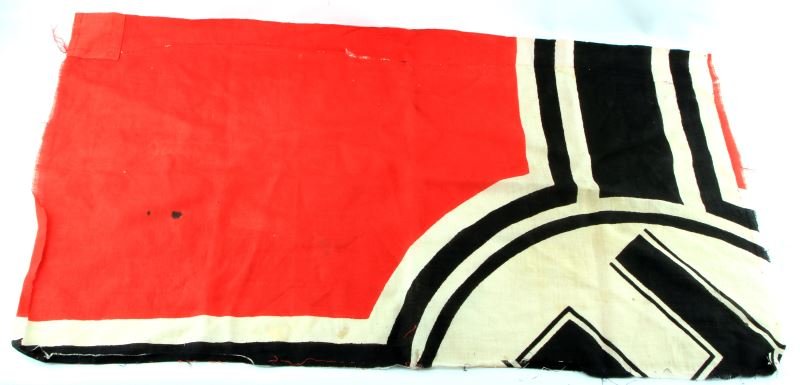 THIRD REICH WAR ENSIGN GI BRING BACK QUARTER FLAG: Large Third Reich war ensign, Reichskriegsflagge, appears to have been cut into quarters by GI. This portion of the flag measures 24.5 by 44.5 inches. Made out of a light weight coarse fabric. The edg