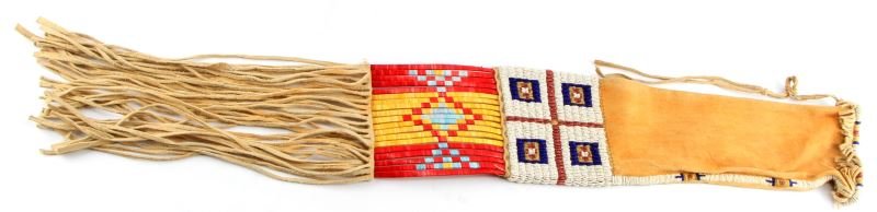 GREAT BEADED CROW PIPE BAG W QUILLED PANELS: Early 20th century pipe bag, measuring 27 inches with frill, brain tanned leather, well crafted and free of detractions.