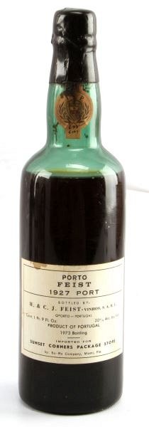 1927 PORTO FIEST VINTAGE PORT WINE 1 PT 9 FL OZ: Vintage 1927 Porto Feist, bottled in 1973. Label and seal still present. Low shoulder ullage. Cherry red color. The label has some stains on the edges, but overall good condition. Tight wax sealed cor