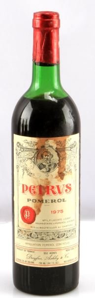 VINTAGE 1975 PETRUS POMEROL MERLOT RED WINE: Vintage 1975 Petrus Pomerol Merlot red wine. Label and seal still present. Top shoulder ullage. Cherry red color. The label has stains throughout, but is in very good condition . Tight sealed cork. 73